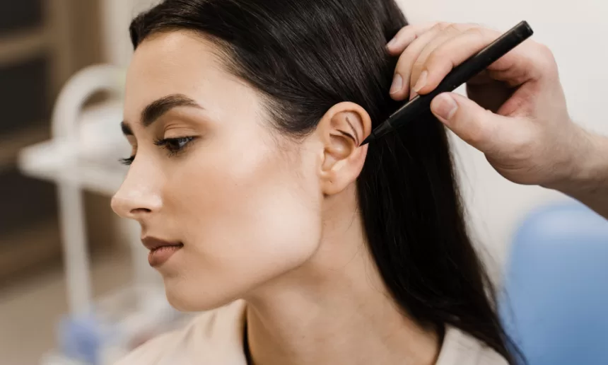 A woman receives a haircut from a stylist, showcasing her new look and confidence in a salon setting.