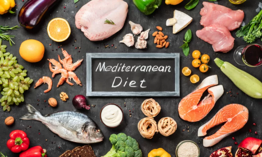 A colorful spread of Mediterranean diet foods, featuring fresh vegetables, grains, and healthy fats on a rustic table.
