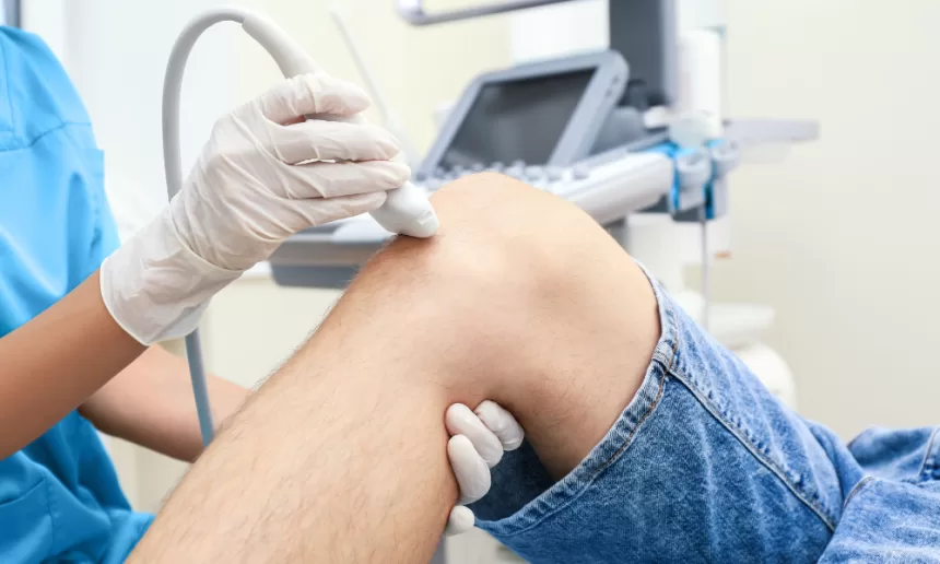 A patient receiving a knee injection, highlighting the importance of vascular surgery procedures like carotid endarterectomy.