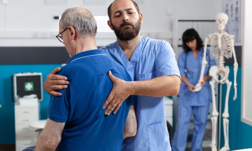 Surgeon performing spinal cord tumor surgery in an operating room